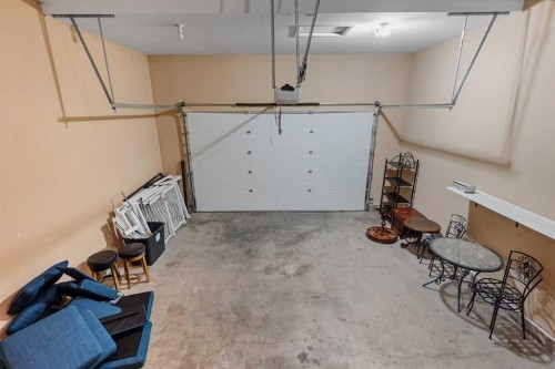 4 Heritage Point West, Lethbridge, AB - Indoor Photo Showing Garage