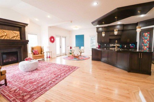 4 Heritage Point West, Lethbridge, AB - Indoor Photo Showing Living Room With Fireplace