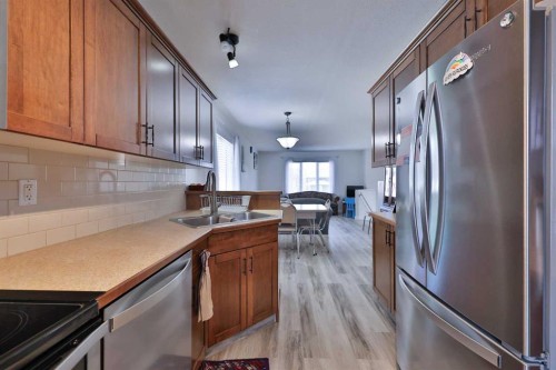 1988 Parkside Way, Coaldale, AB - Indoor Photo Showing Kitchen With Stainless Steel Kitchen With Double Sink