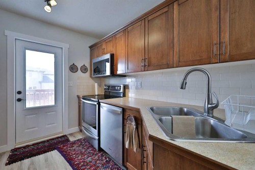 1988 Parkside Way, Coaldale, AB - Indoor Photo Showing Kitchen With Double Sink
