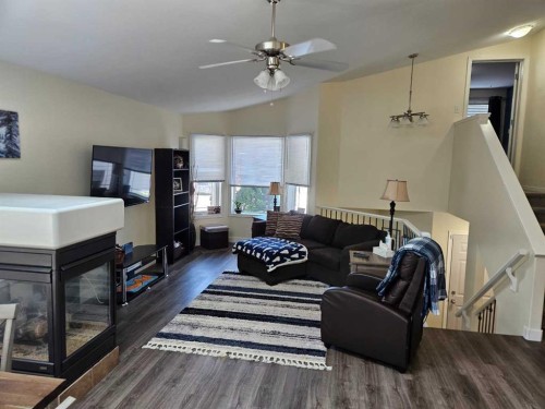 58 Heritage Circle West, Lethbridge, AB - Indoor Photo Showing Living Room With Fireplace