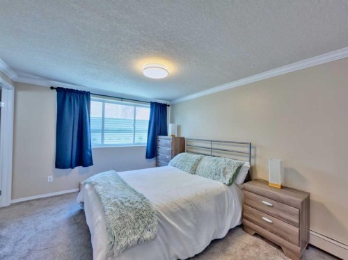 9-1739 St Edwards Boulevard North, Lethbridge, AB - Indoor Photo Showing Bedroom