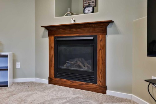 4 Rivermill Landing West, Lethbridge, AB - Indoor Photo Showing Living Room With Fireplace