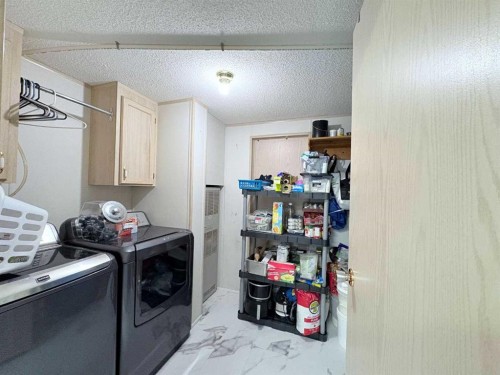 On 252 Range, Rural Cardston County, AB - Indoor Photo Showing Laundry Room