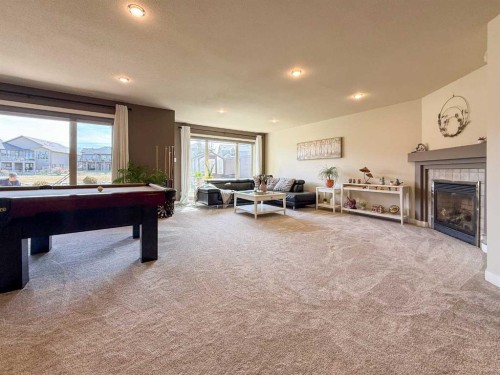 534 Canyon Cove West, Lethbridge, AB - Indoor Photo Showing Other Room With Fireplace