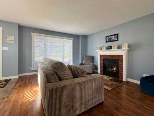 86 Riverstone Boulevard West, Lethbridge, AB - Indoor Photo Showing Living Room With Fireplace