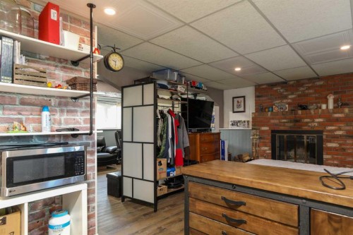 97 Laval Court West, Lethbridge, AB - Indoor With Fireplace