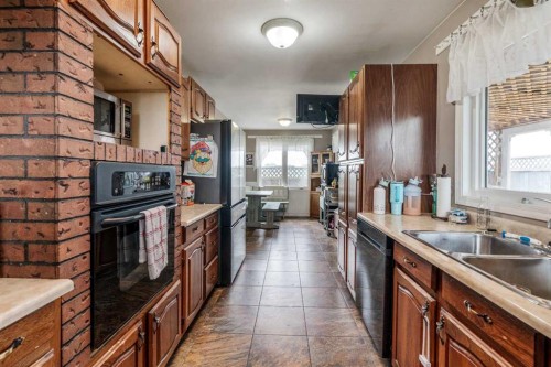 4716 Heritage Drive, Taber, AB - Indoor Photo Showing Kitchen With Double Sink
