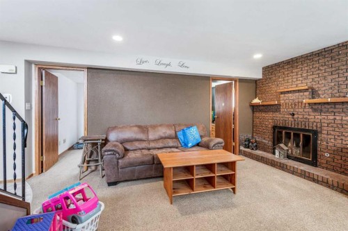 4716 Heritage Drive, Taber, AB - Indoor Photo Showing Living Room With Fireplace