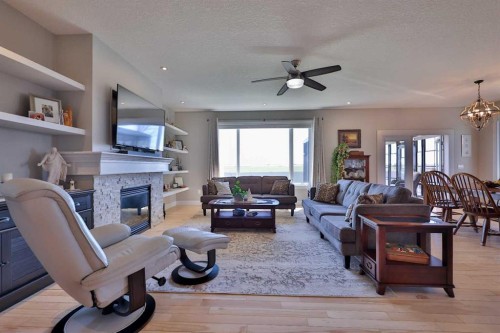 397 S 250 W, Raymond, AB - Indoor Photo Showing Living Room With Fireplace