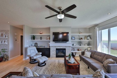 397 S 250 W, Raymond, AB - Indoor Photo Showing Living Room With Fireplace