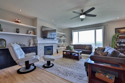 397 S 250 W, Raymond, AB - Indoor Photo Showing Living Room With Fireplace