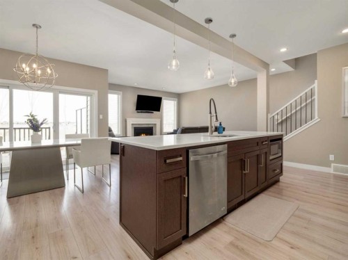 413 Devonia Way West, Lethbridge, AB - Indoor Photo Showing Kitchen With Fireplace