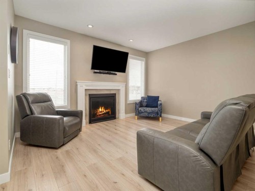 413 Devonia Way West, Lethbridge, AB - Indoor Photo Showing Living Room With Fireplace