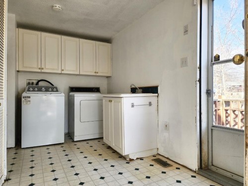 234 49 Ave E, Claresholm, AB - Indoor Photo Showing Laundry Room