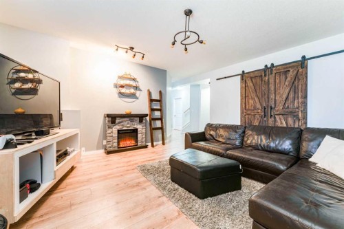 4214 56 Street, Taber, AB - Indoor Photo Showing Living Room With Fireplace