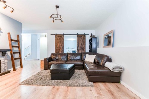 4214 56 Street, Taber, AB - Indoor Photo Showing Living Room With Fireplace