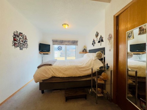 7710 24 Avenue, Coleman, AB - Indoor Photo Showing Bedroom