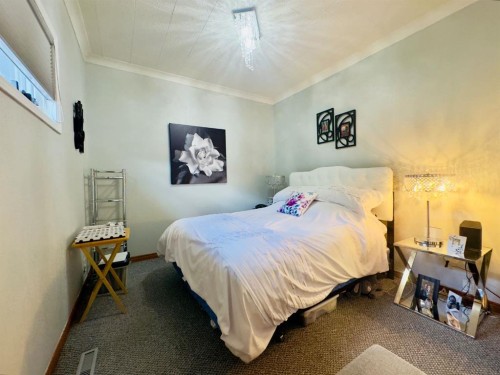 7710 24 Avenue, Coleman, AB - Indoor Photo Showing Bedroom