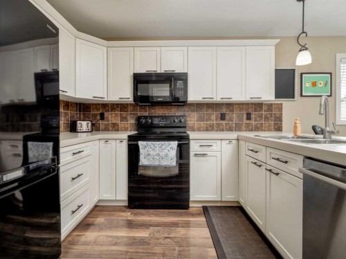 553 Mary Cameron Crescent North, Lethbridge, AB - Indoor Photo Showing Kitchen With Double Sink