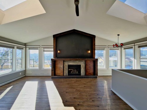 8149 26 Avenue, Coleman, AB - Indoor Photo Showing Living Room With Fireplace