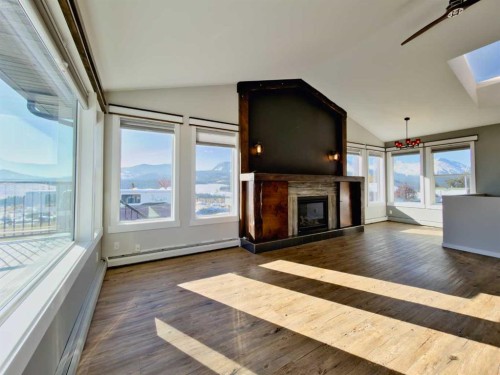 8149 26 Avenue, Coleman, AB - Indoor Photo Showing Living Room With Fireplace