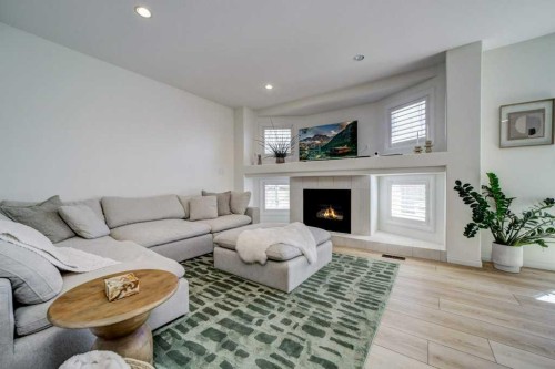 286 Twinriver Road West, Lethbridge, AB - Indoor Photo Showing Living Room With Fireplace
