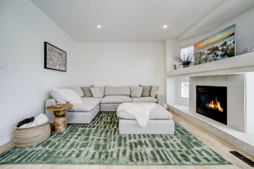 286 Twinriver Road West, Lethbridge, AB - Indoor Photo Showing Living Room With Fireplace