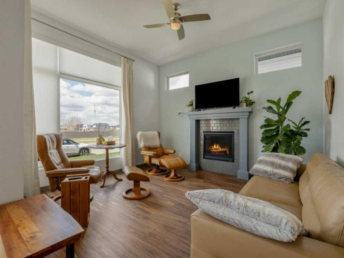 350 Uplands Boulevard North, Lethbridge, AB - Indoor Photo Showing Living Room With Fireplace