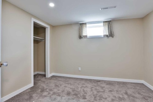 155E 100N, Raymond, AB - Indoor Photo Showing Other Room