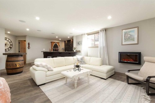 442 Stonecrest Terrace West, Lethbridge, AB - Indoor Photo Showing Living Room With Fireplace
