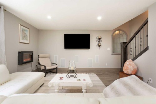 442 Stonecrest Terrace West, Lethbridge, AB - Indoor Photo Showing Living Room With Fireplace