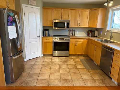 43 Riverwood Manor West, Lethbridge, AB - Indoor Photo Showing Kitchen With Double Sink