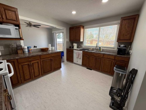 73 Mcgill Boulevard West, Lethbridge, AB - Indoor Photo Showing Kitchen With Double Sink