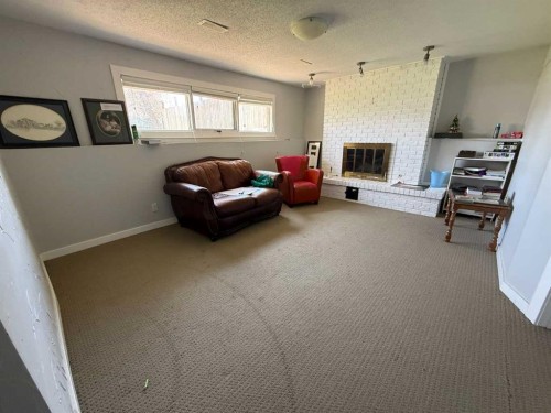 73 Mcgill Boulevard West, Lethbridge, AB - Indoor With Fireplace