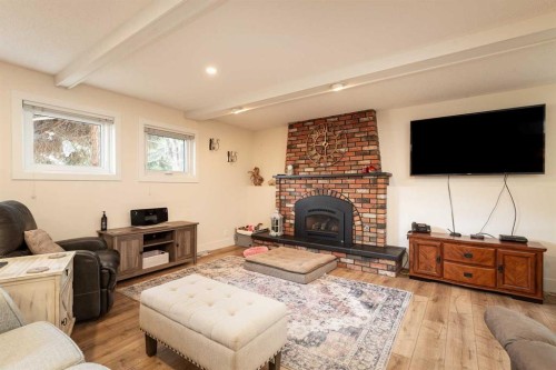 321 Normandy Road South, Lethbridge, AB - Indoor Photo Showing Living Room With Fireplace