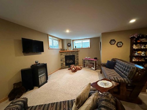 21 Ironstone Drive, Coleman, AB - Indoor With Fireplace
