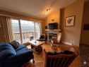 21 Ironstone Drive, Coleman, AB  - Indoor Photo Showing Living Room With Fireplace 