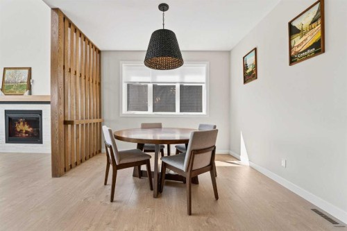 640 Devonia Road West, Lethbridge, AB - Indoor Photo Showing Dining Room With Fireplace