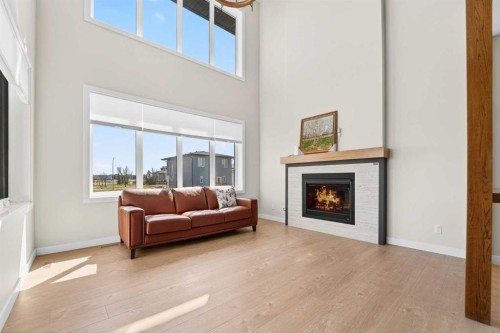640 Devonia Road West, Lethbridge, AB - Indoor Photo Showing Living Room With Fireplace