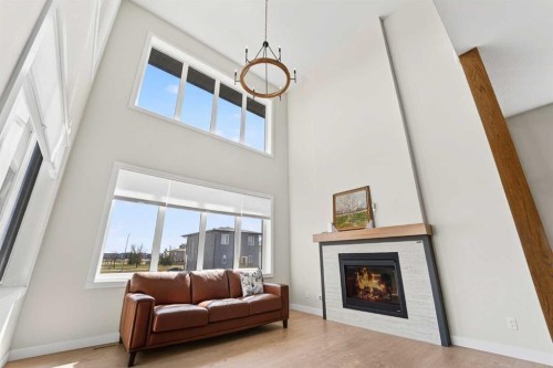 640 Devonia Road West, Lethbridge, AB - Indoor Photo Showing Living Room With Fireplace