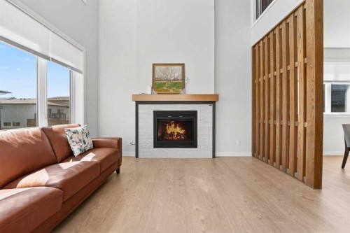 640 Devonia Road West, Lethbridge, AB - Indoor Photo Showing Living Room With Fireplace
