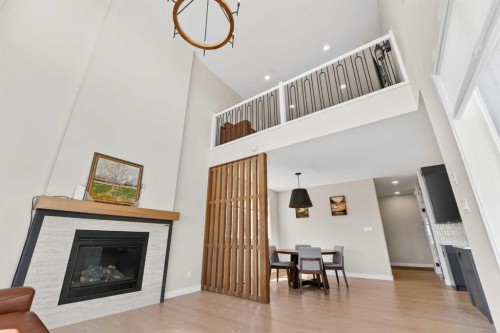 640 Devonia Road West, Lethbridge, AB - Indoor Photo Showing Living Room With Fireplace