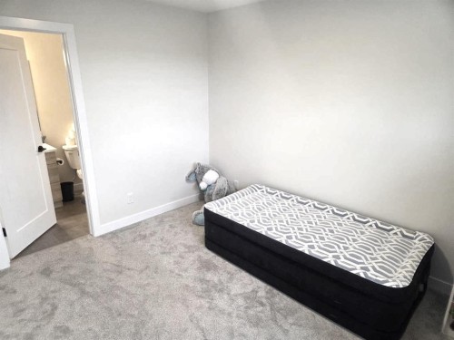 A & B-50 Sage Brush Avenue, Taber, AB - Indoor Photo Showing Bedroom