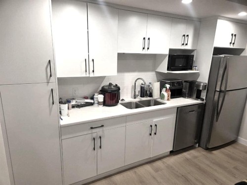 A & B-50 Sage Brush Avenue, Taber, AB - Indoor Photo Showing Kitchen With Double Sink