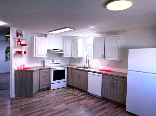 6314 48 Street, Taber, AB - Indoor Photo Showing Kitchen With Double Sink