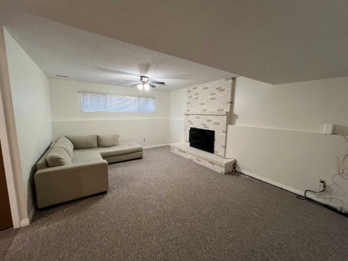 197 Oxford Road West, Lethbridge, AB - Indoor With Fireplace