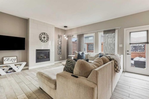 1544 Coalbanks Boulevard West, Lethbridge, AB - Indoor Photo Showing Living Room With Fireplace