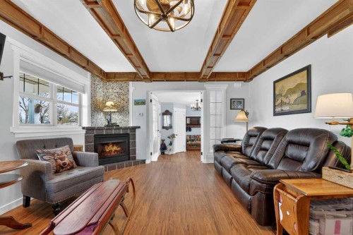 4717 2 Street West, Claresholm, AB - Indoor Photo Showing Living Room With Fireplace