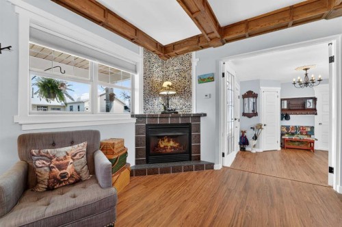 4717 2 Street West, Claresholm, AB - Indoor Photo Showing Living Room With Fireplace